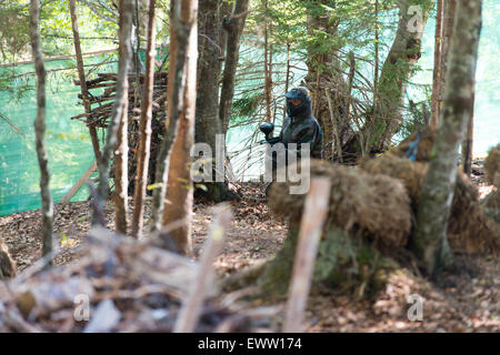 Prêt pour le tir de sniper Paintball Banque D'Images