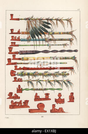 Les tuyaux du tabac des Américains autochtones, et d'un calumet de la paix avec la guerre-plumes d'aigle en haut. Les tuyaux sont sculptées de pipe-pierre, stéatite rouge. Lithographie coloriée de George Catlin's Manners, les douanes et l'état des Indiens d'Amérique du Nord, Londres, 1841. Banque D'Images