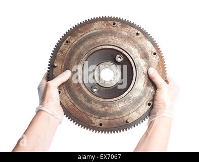 Worker's male hands holding engine's fragment Banque D'Images