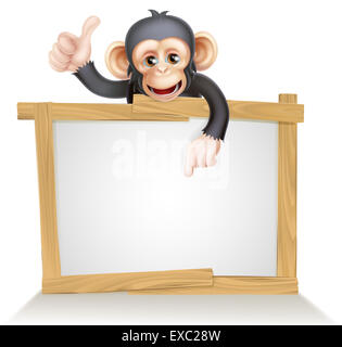 Cute cartoon singe chimpanzé comme le caractère mascot peeking au-dessus d'un signe, pointant sur elle et de donner un coup de pouce Banque D'Images