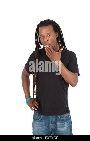 Bel homme avec des dreadlocks faisant différentes expressions dans différents ensembles de vêtements : yawning Banque D'Images