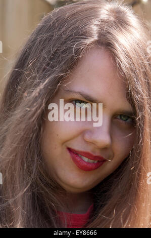Close-up portrait of teenage girl wearing red lipstick Banque D'Images