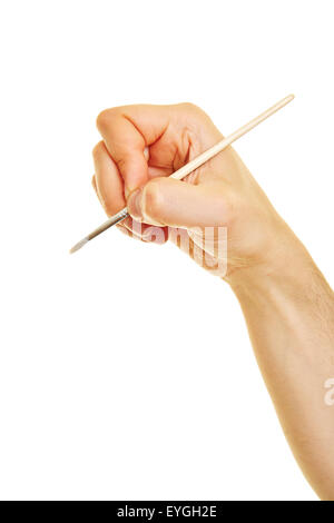 Vue de côté de main tenant un pinceau tandis que la peinture Banque D'Images