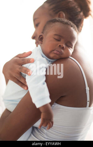 Close up of Black Mother holding sleeping baby