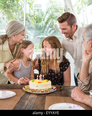 Caucasian family celebrating birthday at table Banque D'Images