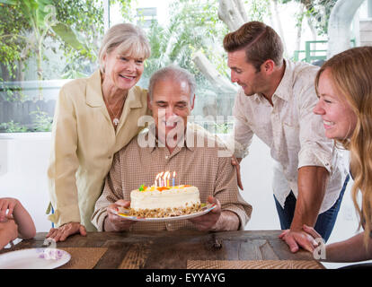 Caucasian family celebrating birthday at table Banque D'Images