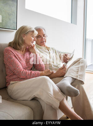 Caucasian couple on sofa