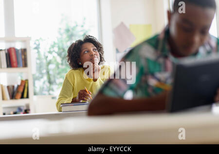 Black Student thinking in classroom Banque D'Images