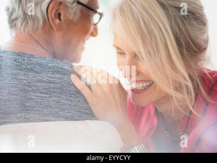 Close up of Caucasian woman whispering Banque D'Images