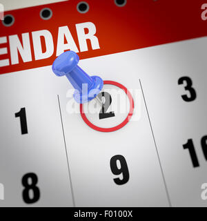 Calendrier et punaise bleue. Marque sur le calendrier à 2. Banque D'Images