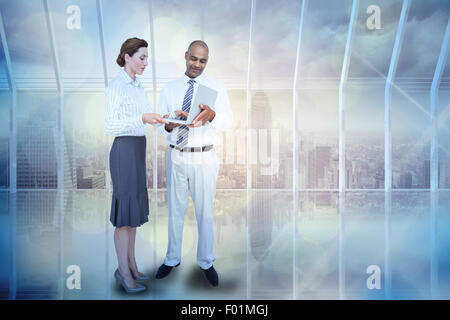 Image composite de business people using laptop Banque D'Images