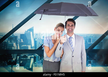 Image composite des gens d'affaires tenant un parapluie noir Banque D'Images