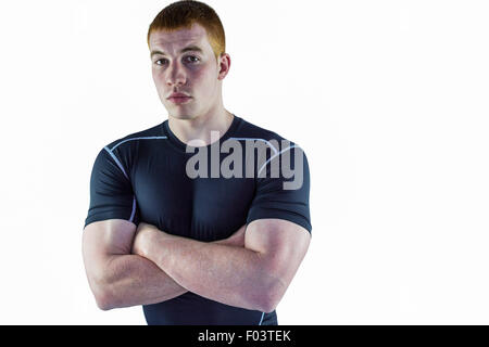 Joueur de rugby musclé avec les bras croisés Banque D'Images