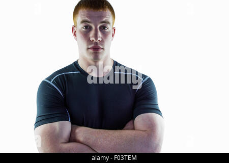 Joueur de rugby musclé avec les bras croisés Banque D'Images