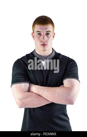 Rugby player with arms crossed