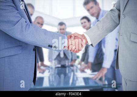 Composite image shaking hands Banque D'Images