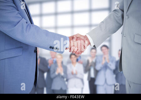 Composite image shaking hands Banque D'Images