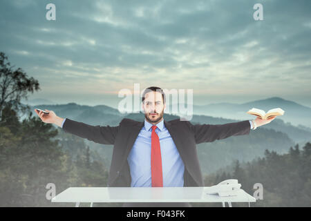 Composite image of businesswoman sitting with arms outstretched Banque D'Images