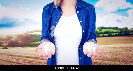 Image composite de femme présentant ses mains Banque D'Images