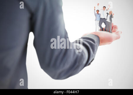 Image composite des gens d'affaires cheering in office Banque D'Images