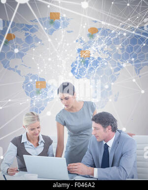 Image composite de business people using laptop Banque D'Images