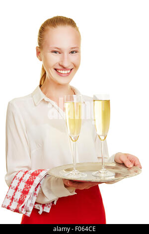 Female waiter serving champagne dans les verres sur un plateau Banque D'Images