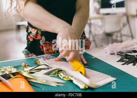 Close up of female designer textile textiles coupe in design studio Banque D'Images