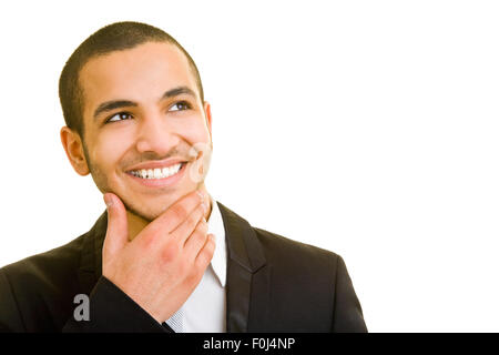 Happy manager penser tout en regardant vers le haut et de toucher son menton Banque D'Images