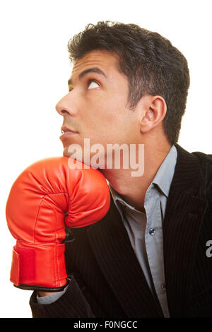 Business man with red boxing gloves penser Banque D'Images