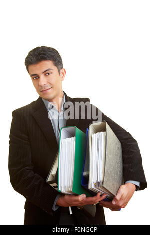 Businessman carrying beaucoup de fichiers Banque D'Images