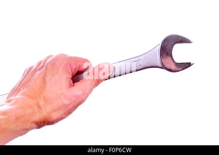 Main tenant une clé mixte isolated on white Banque D'Images