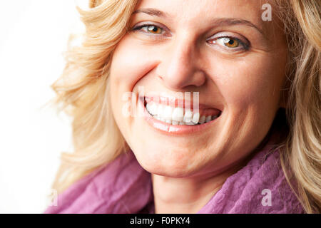 Happy young woman smiling over white Banque D'Images