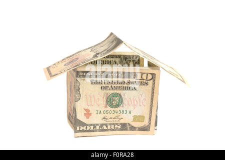 La forme fait maison avec des dollars représentant la valeur de la propriété Banque D'Images