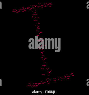 La Volée d'oiseaux dans la forme de la lettre i Banque D'Images