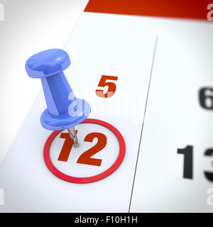 Calendrier et pousser l'axe bleu. Marque sur le calendrier en 12. Banque D'Images