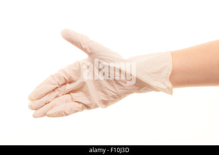 Close up de la main du médecin en blanc les gants chirurgicaux stérilisés pour donner handshake against white background Banque D'Images