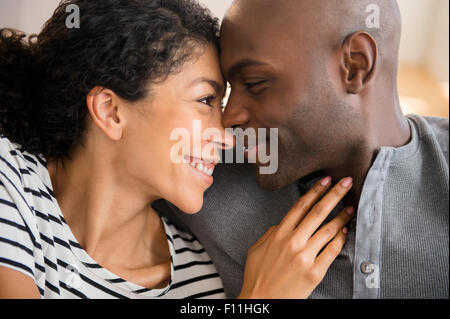 Close up of smiling woman rubbing noses Banque D'Images