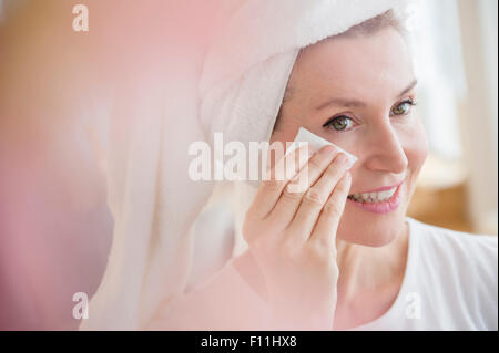 Portrait woman wiping face Banque D'Images