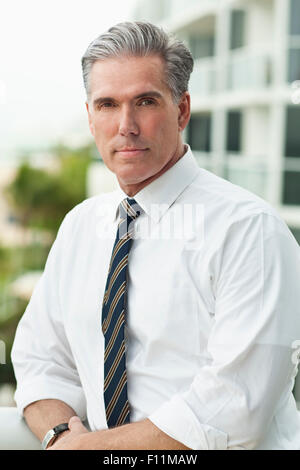 Close up of serious Caucasian businessman outdoors Banque D'Images