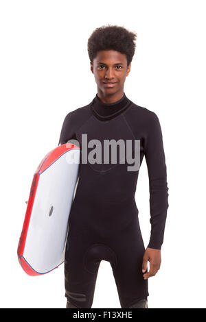 Un jeune noir bodyboarder posing in studio Banque D'Images