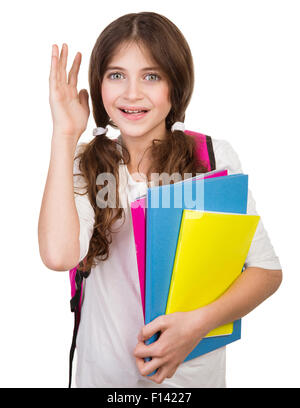 Portrait of cute schoolgirl avec sac et des livres en mains isolé sur fond blanc, le retour à l'école, prêt à étudier Banque D'Images