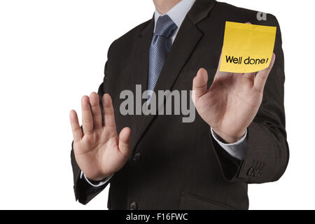 Businessman hand montrent bien fait mots sur Post-it avec un fond blanc comme concept Banque D'Images