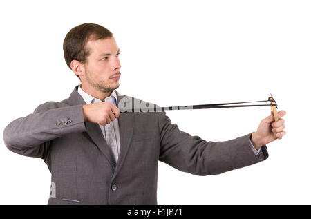 Bel homme d'affaires visant un concentré isolés slingshot over white background Banque D'Images