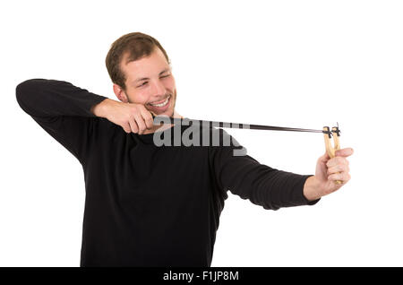 Hansome man concentrées visant une fronde isolated over white background Banque D'Images