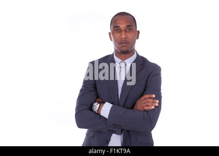 Malheureux business man with folded arms sur fond blanc - les noirs Banque D'Images