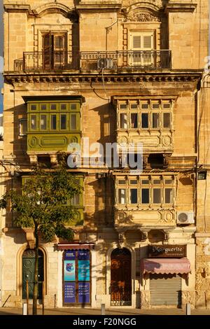 Malte, Birgu, Vittoriosa, façade d'un ancien bâtiment en pierre au coucher du soleil Banque D'Images