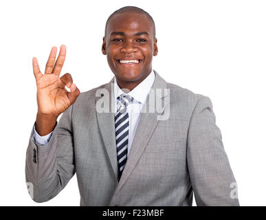 Portrait of happy young woman showing ok sign on white background Banque D'Images