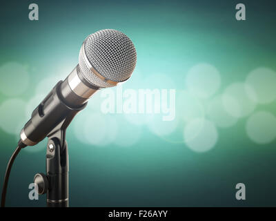 Microphone sur le green abstract background. 3d Banque D'Images