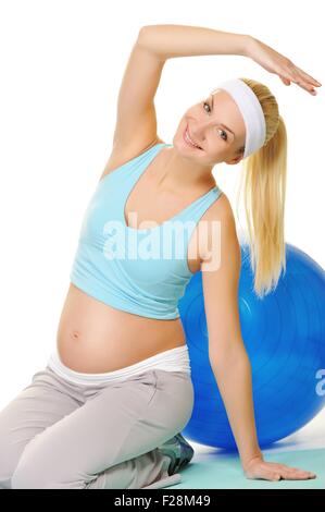 Jeune femme enceinte faire l'exercice Banque D'Images