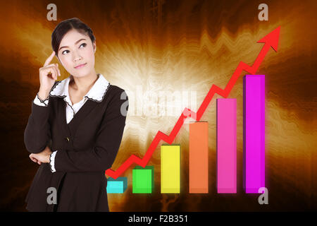 Business Woman thinking with business graph on background Banque D'Images